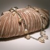 Ivory satin clutch with pleated pattern with chain and pearls