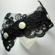 Headband with black embroidery application and pearls