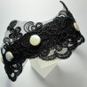 Headband with black embroidery application and pearls