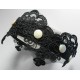 Headband with black embroidery application and pearls